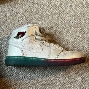 White and rainbow sole Jordan 1s mid